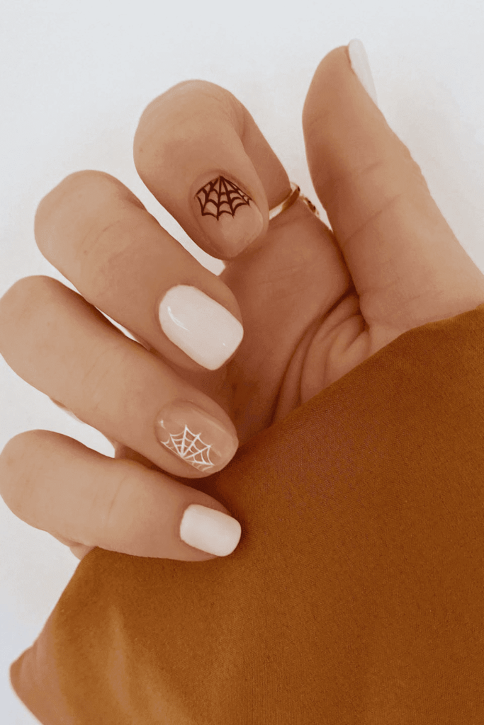 nails with spider web