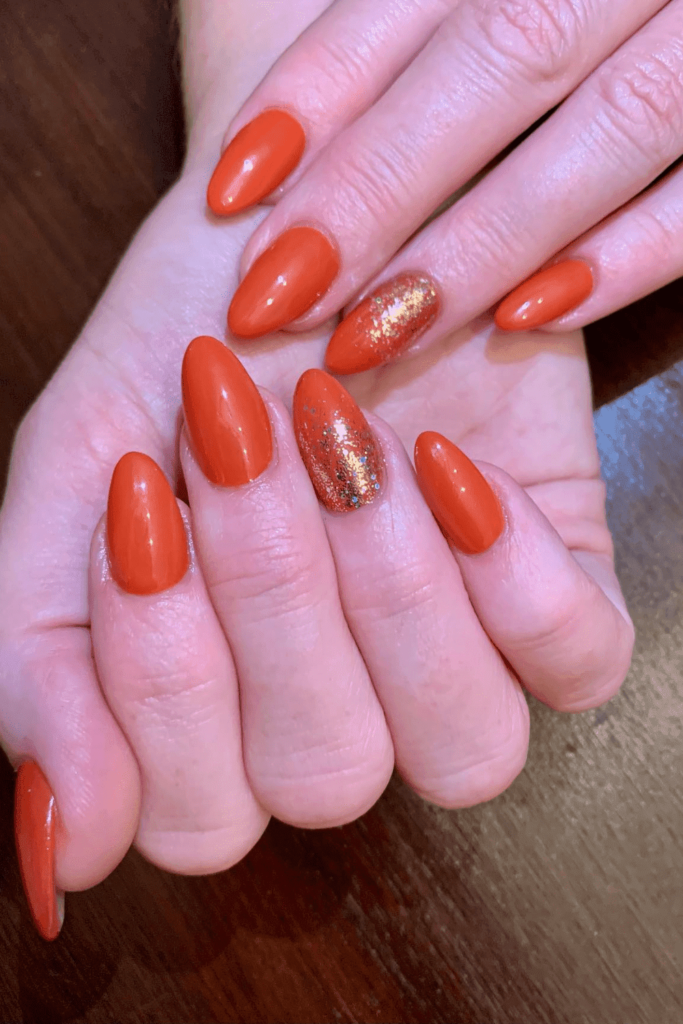 Burnt orange nail with glitter