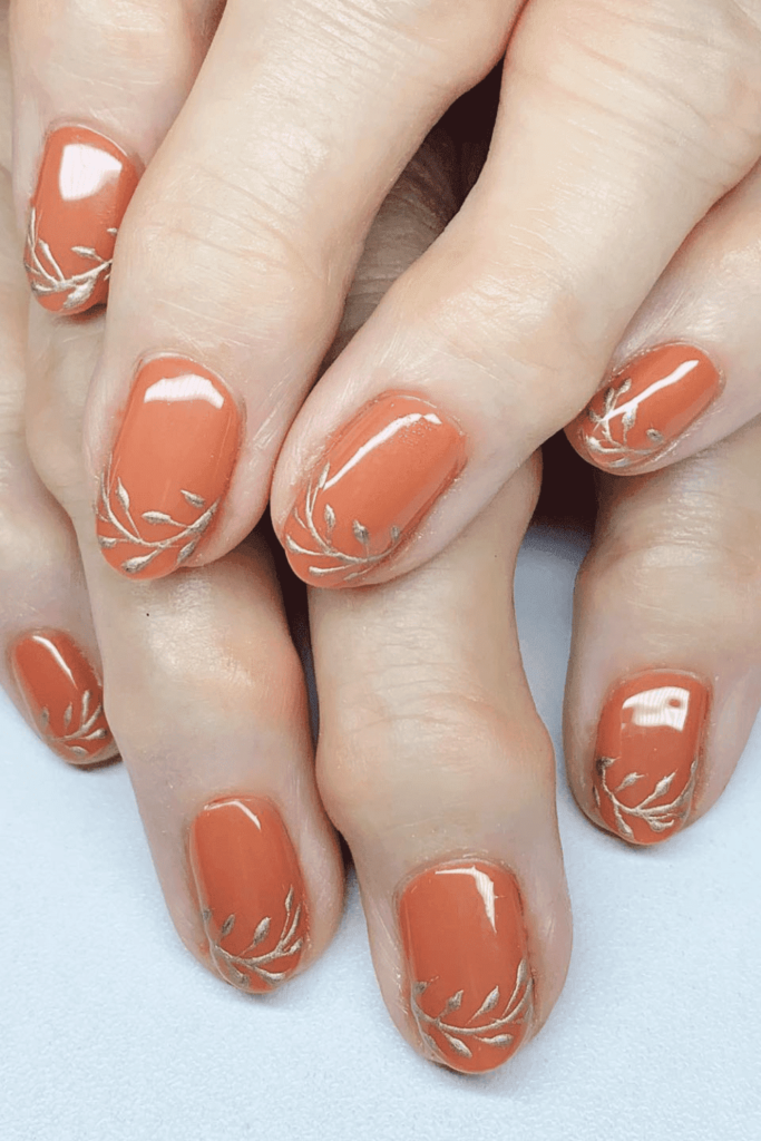 Gold Leaves on Burnt Orange Nails