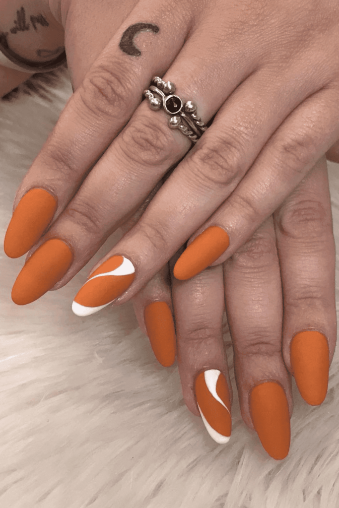 White Swirls Burnt Orange Nails Idea